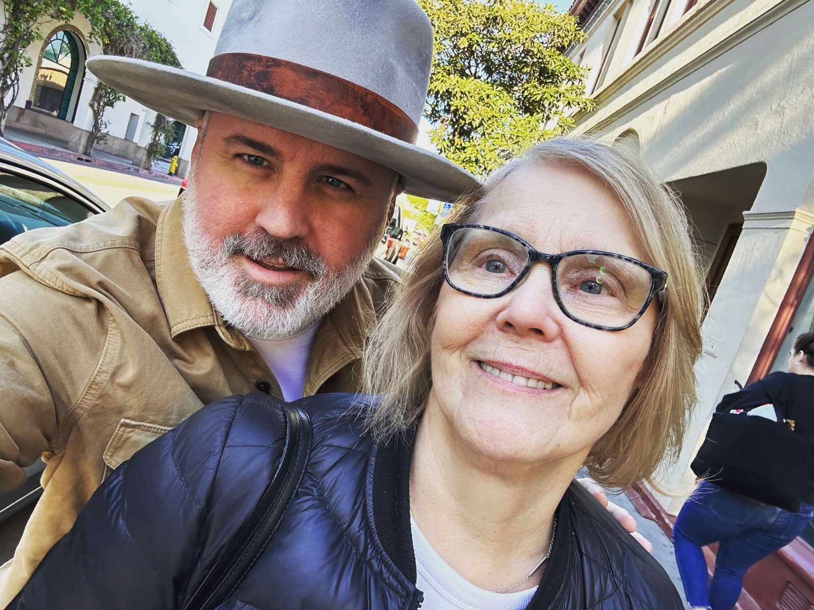 Travis Avery with his mother, standing together outdoors