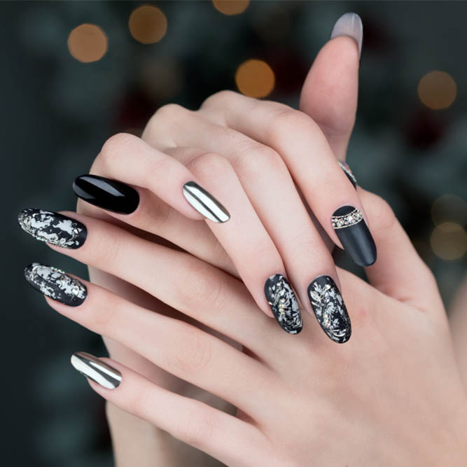 Black and silver nails with glitter and metallic finishes.
